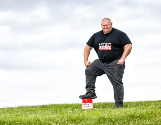 Former UK and Europes Strongest Man Glenn Ross takes Giant Steps to help launch the Action Cancer Giants Walk.