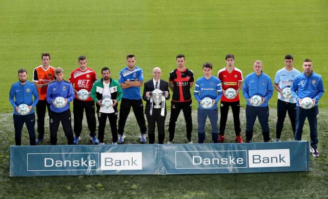 Press Eye - Belfast -  Northern Ireland - 03rd August 2016 - Photo by William Cherry  Pictured at the launch of the Danske Bank Premiership are Kevin Kingston, CEO of Danske Bank and players from each of the 12 league teams.  The launch was held at the National Stadium at Windsor Park.