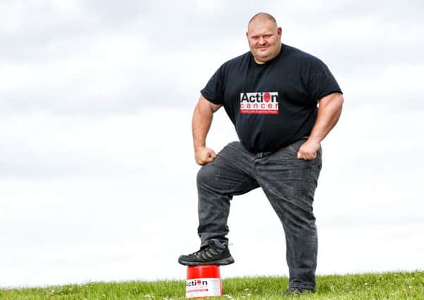 Former UK and Europes Strongest Man Glenn Ross takes Giant Steps to help launch the Action Cancer Giants Walk.