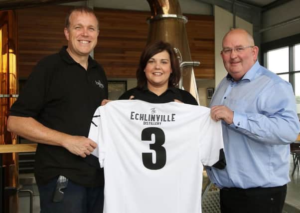 The Echlinville Distillery is now the back of shirt sponsor for Lisburn Distillery FC. Pictured with the club's home shirt at the Echlinville Distillery are (l-r) Graeme Millar (Echlinville Operations Manager), Suzanne McCullough (Echlinville Office, Sales & Marketing Executive) and Shane Braniff (Owner - Echlinville Distillery). Picture - David Hunter.
