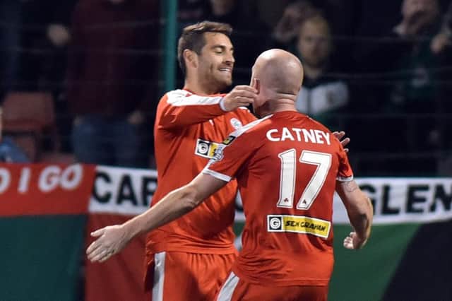 Cliftonville's David McDaid celebrates after scoring to make it 2-0 
during tonight's match at Solitude.
Photo by TONY HENDRON/Presseye.com.