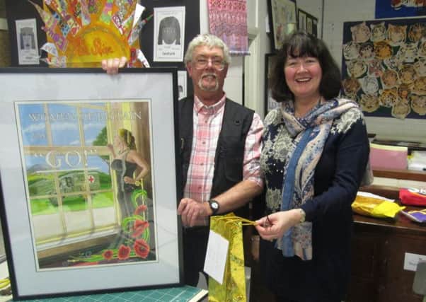 President Rosemary Holland presents a thank you gift to Exhibition Co-ordintator Jamie Crabbe for his demo.