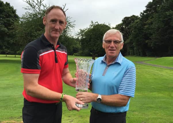 Keith Walker winner of the First Trust Trophy with Portadown club captain Stanley Jelly.