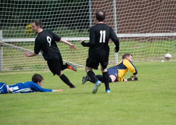 Simon Foster finds the net for Laurelvale against AFC Silverwood.