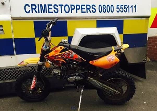 Police seized this scrambler-style motorbike in Rushpark on Wednesday, August 10. INNT 33-501CON