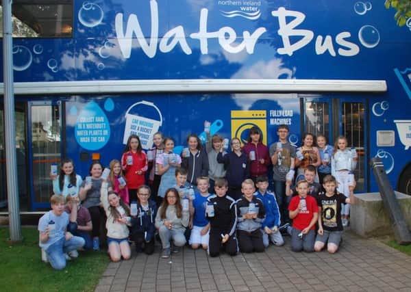 Children and young people check out the Waterbus during its recent visit to Glengormley. INNT 33-509CON