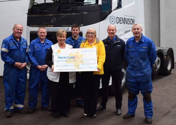 Dennison Commercials staff Henry Turkington, Paul Gillan, Neil Arbuthnot, John Johnston, Emyrs McBurney and Gwen Hill hand over the cheque to Alison Wilson, Regular Care Giving Fundraiser at Marie Curie. INNT 33-504CON