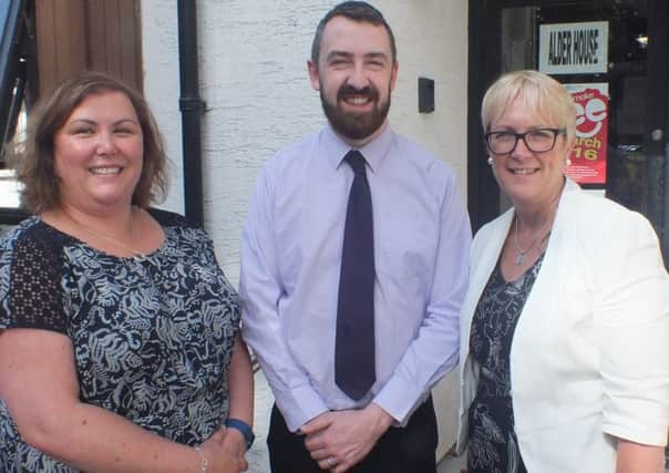Carolyn Ewart, NIASW Country Manager and Daithi McKay, MLA, are welcomed to the Northern Trust by Marie Roulston, Executive Director for Social Work, as they embark on their visit to meet Northern Trust social workers.