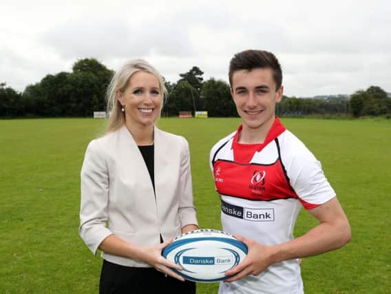 Ballyclare High School player Jack Lewis is pictured with Nicola McCleery, Head of Marketing at Danske Bank.