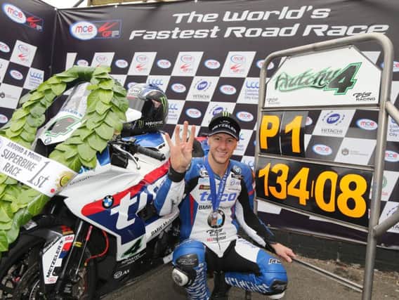 Ian Hutchinson celebrates his famous four-timer at the MCE Ulster Grand Prix on Saturday.