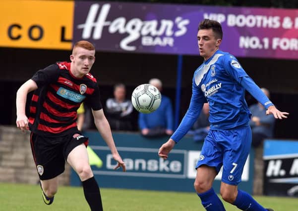 Dungannon Swifts' Jamie Glackin
and Coleraine's Rodney Brown