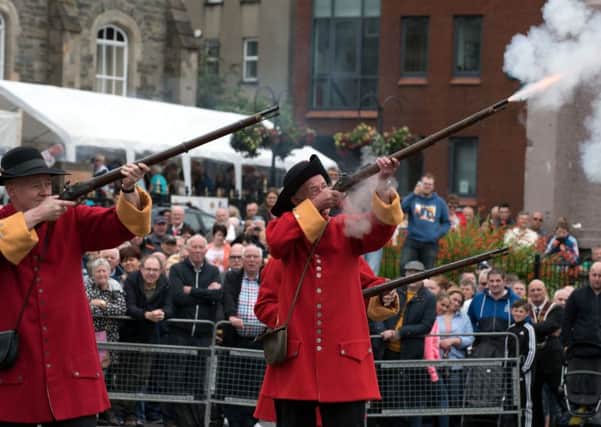 Musket fire during the pageant at the annual Apprentice Boys' parade on Saturday