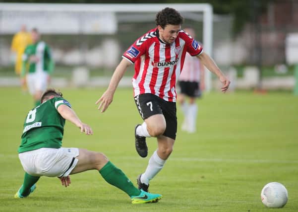 Derry's Barry McNamee skips away from the challenge of Cork's Greg Bolger at Brandywell Stadium on Monday night.

(Photo Lorcan Doherty / Presseye.com)
