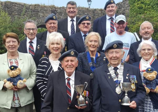 Members of the RAF Association showing off the trophies they won for the highest collection in 2015.  INCT 34-736-CON