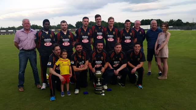 Eglinton side and back-room team celebrate winning the Faughan Valley Cup after defeating Brigade by seven wickets.