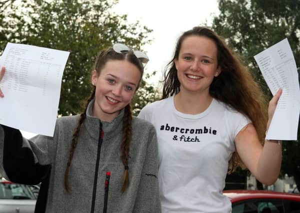 Ballyclare High students Katelyn Irwin (A*, A, A) and Lauren Kelly (B,C,C) were delighted with their A Level results. INNT 34-505CON Pics by Freddie Parkinson, Press Eye
