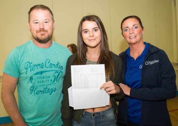 Year 14 pupil Emma Sugden with her parents.  INCT 34-725-CON