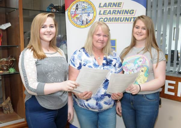 Twins, Rachel and Louise McDowell who attend Larne High School share their A level results with their mother. INLT 34-200-AM