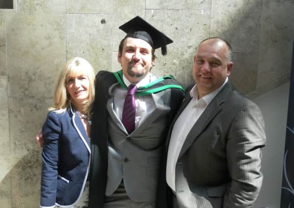 Jordan (middle) with proud parents Colin and Dawn.