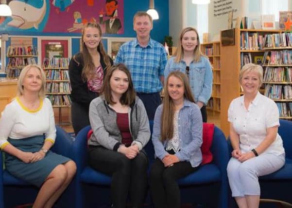 Local students were among the top achieving students at Saint Catherines College. Front from left, principal Noeleen Tiffney, Niamh Haughian, Ciara McGrane and senior teacher  Fionnuala Tennyson. Back from left,  Eimear Rodgers, senior teacher and parent Paul Rodgers and Caoimhe Lambe. Absent from photo: Anna McCann. INPT34-032