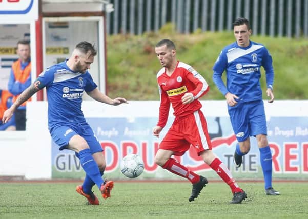 Cliftonville's Martin Donnelly and Dungannon Swifts' Ryan Harpur
