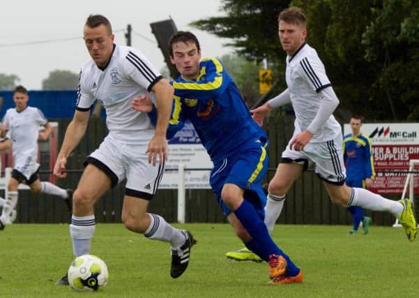 Jonny Roy in action for Rathfriland against Moyola on Saturday. Pic: Iain McDowell / Rathfriland FC.