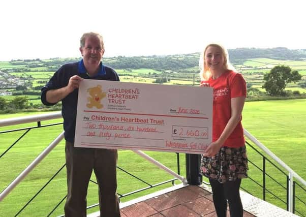 (file photo) Jeremy Jones, Whitehead Golf Club captain, presents Sarah Quinlan from the NI Children's Heartbeat Trust with a cheque for Â£2,660. The monies were raised from donations by Whitehead Golf Club members to the Captain's Charity.  INCT 29-724-CON