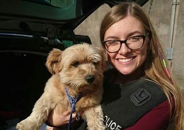 Charlotte McClelland with lost dog Milo, who was later reunited with his owner. INPT35-101