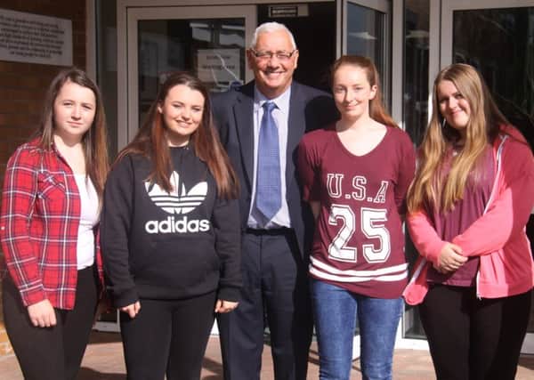 Principal, Lex Hayes, pictured with students on GCSE results day. INNT 35-804CON