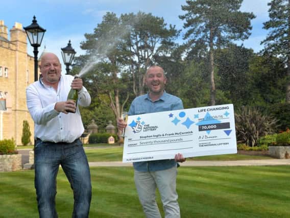 NEVER BIN BETTER:  County Down bin men Stephen Inglis (46), from Bangor, and Frank McCormick (44), from Newtownards, celebrate their wheelie good fortune after collecting a tasty 70,000 from a National Lottery Scratchcard.