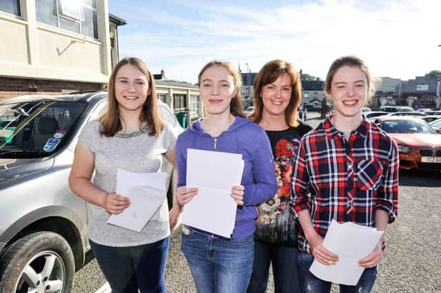 Siobhan, Maeve and Mary Mallon celebrating no less than 3 sets of GCSE results with their mum at Holy Trinity College.