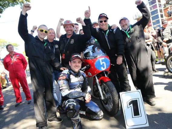 Michael Dunlop celebrates his Classic TT Junior win with the Black Eagle MV Agusta team.