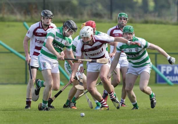 Slaughtneil's Meehaul McGrath with Malachi O'Hagan and Tommy McCloy of Swatragh during the Derry Senior Hurling Championship semi-final at Owenbeg. (Picture Margaret McLaughlin)