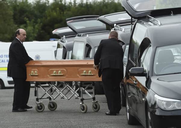 Coffins are taken to hearses at the scene in Oakdene, Barconey, Ballyjamesduff in Cavan, where a family of five were found dead in their countryside home. Photo: Philip Fitzpatrick/PA Wire