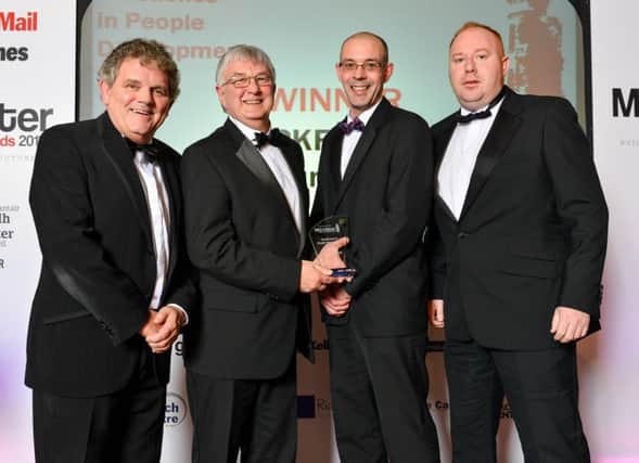 Ruairi Martin from PKF-FPM Accountants receives the Excellence in People Development from sponsor, David McConaghie of Henry Bros. Also pictured are Adrian Logan and Patrick Cullen, Mid-Ulster Mail and Tyrone Times Advertising Team Leader.