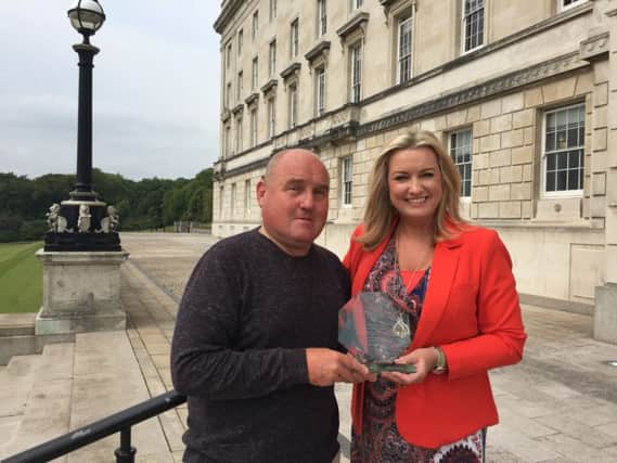 William Johnston, Chairman of the Northern Ireland Kidney Patients Association presenting Jo-Anne Dobson MLA with a plaque in recognition of her continued work to promote the life-saving power of Organ Donation.