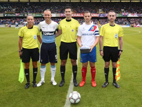Rangers captain Kenny Miller and Linfield captain Jamie Mulgrew before Saturday's testimonial with referee Ian McNabb (centre), assistant referee Rachel Smith (left) and assistant referee Stephen Bell (right). (
Picture by Andrew Paton/Press Eye.com)