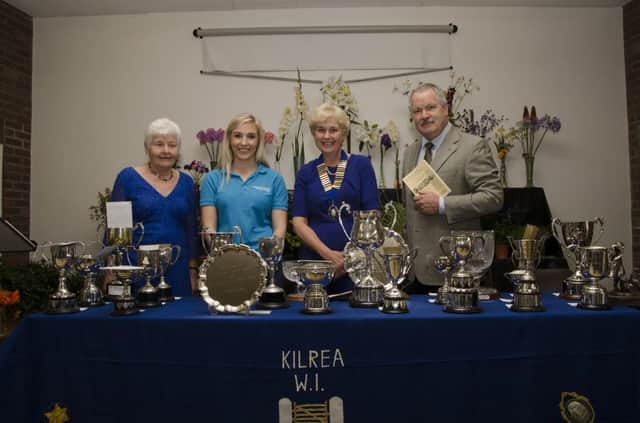 Margaret Bamford, Helen Taylor representative of the Alzheimers Society, Jennifer Gardiner President of the Kilrea Womens Institute and Gordon Craig stand at the top table with the prizes. INCR35-16 005BW
