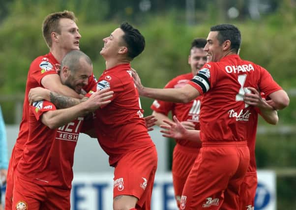 Stephen Hughes and his Portadown team-mates celebrate against Carrick Rangers. Pic by PressEye Ltd.