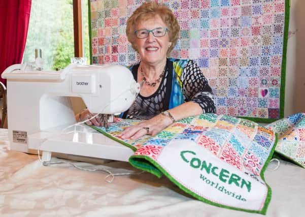 77-year-old Jane Caldwell puts the final touches to Concern Worldwides Stitch for Syria wall hangings made in support of Syrian refugee women who have been traumatised by the conflict (Photo: Andrew Vaughan).