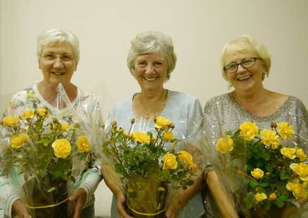 Dorothy Coulter, Moira Martin and Maureen Mitchell who were presented with Golden Anniversary Patio Roses.