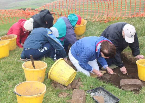Members of the public getting first-hand experience of an archaeological investigation last year. (Submitted Picture).