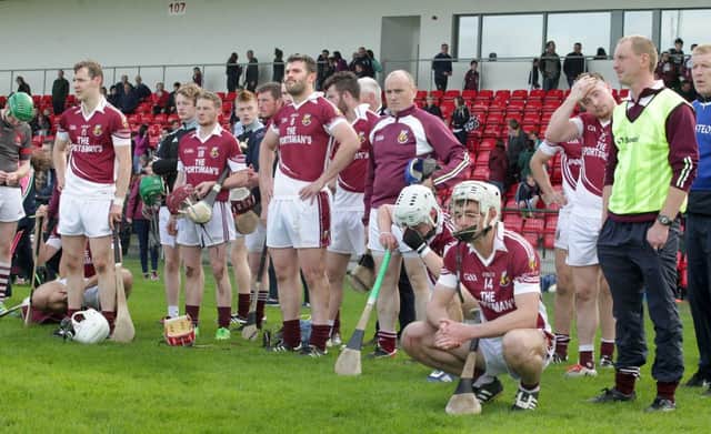 Dejected Banagher players after losing out to Slaughtneil in the Derry Senior Hurling Championship final at Owenbeg.  (Pic: Margaret McLaughlin)