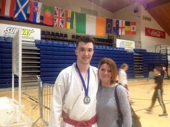 Craig Ryan, who took Gold in the first ever Irish International Karate Open championship in Tallaght, Dublin, pictured with his proud mum, Noreen who has supported him constantly since he started training 11 years ago.