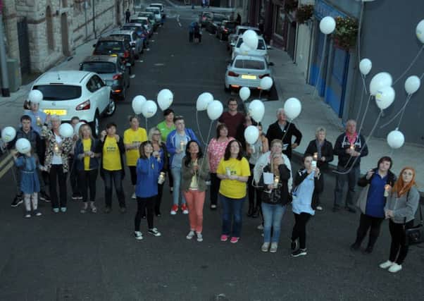 Balloons are released by members and friends of Larne branch of PIPS,to mark World Suicide Prevention Day. INLT 38-200-AM