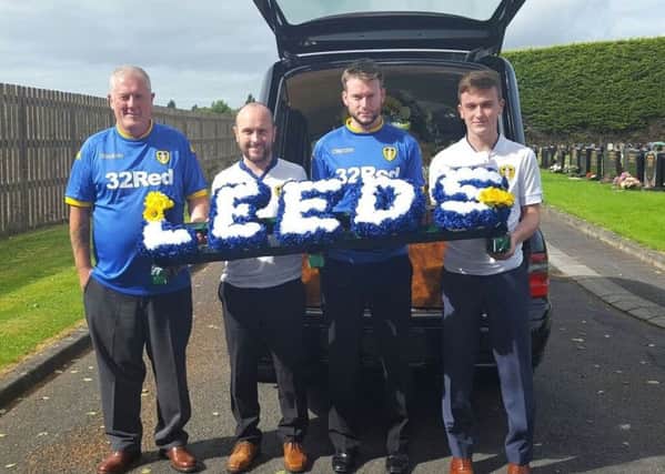 Members of the Irwin family with the special 'LEEDS' wreath they provided for Sammy's funeral.