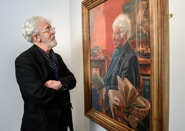 Artist Jeffrey Morgan with his painting of Seamus Heaney