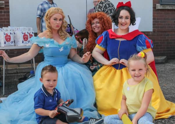 Charlie and Olivia Brown enjoying the fun day along with characters Cinderella, Merida and Snow White INNT 34-500-SO