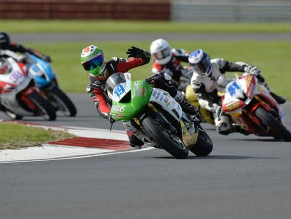 Aaron Clifford celebrates his win in the opening David Wood Memorial Supersport race at Bishopscourt on Saturday.