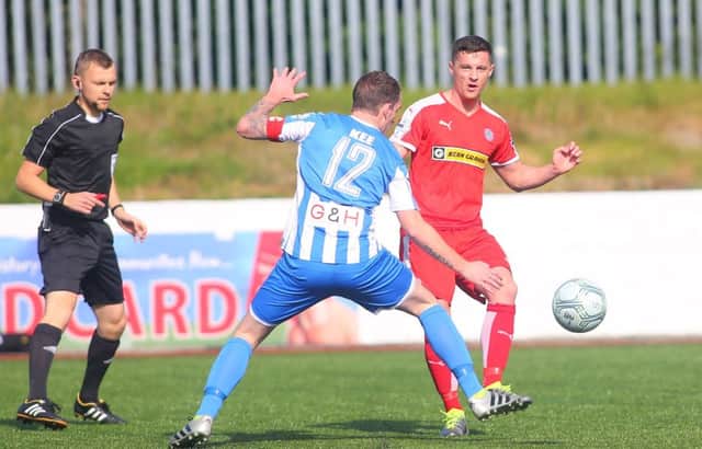 Picture - Kevin Scott / Presseye 

Cliftonville's Ruairi Harkin and Coleraine's David Kee in action during the game at Solitude in North Belfast on 17th September 2016 ( Photo by Kevin Scott / Presseye )